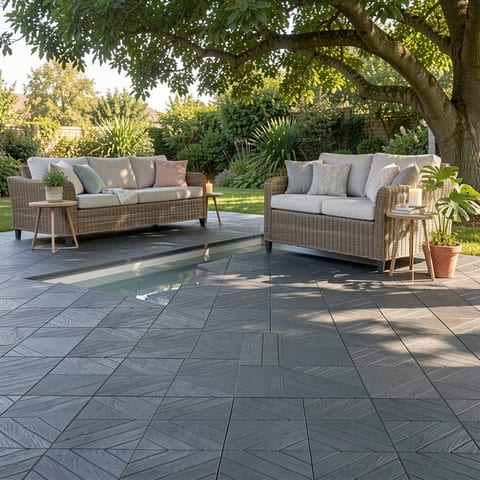 Dark grey interlocking deck tiles around a pool