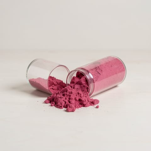Beetroot powder supplement capsules on a clean white background