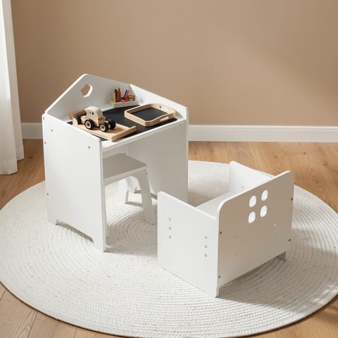 White wooden kids table and chair set in a playroom with toys