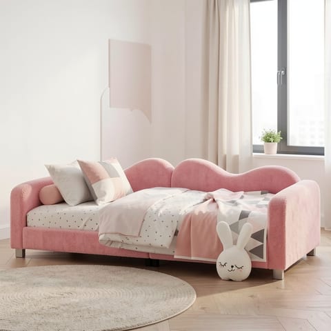 Pink upholstered daybed with cloud-shaped backrest