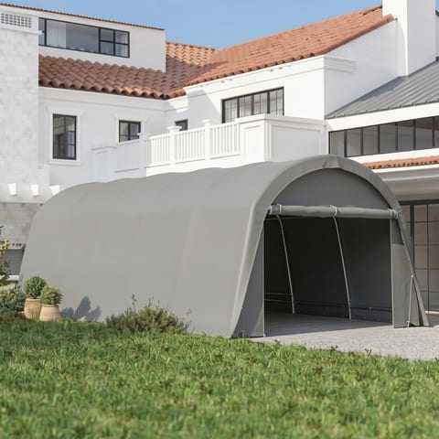 Gray carport with a white car inside, in front of a house