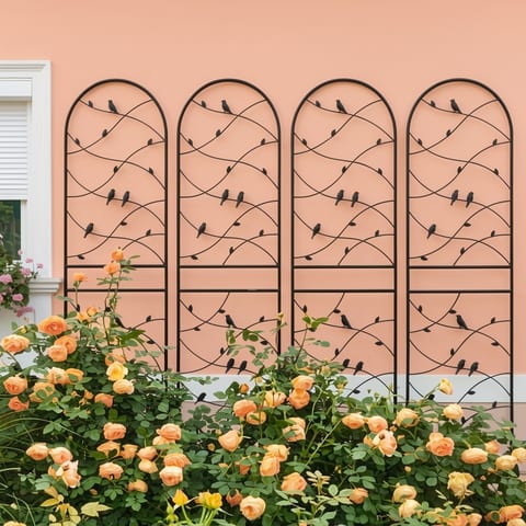 black metal garden trellis with bird and leaf decorations