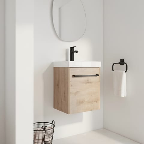 Light wood floating bathroom vanity with white ceramic sink and black faucet