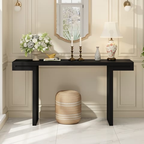 Black console table with geometric clean lines in a stylish entryway