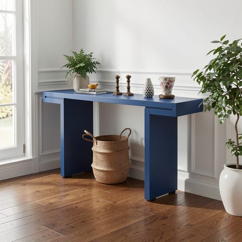 Blue console table with geometric design in a bright entryway