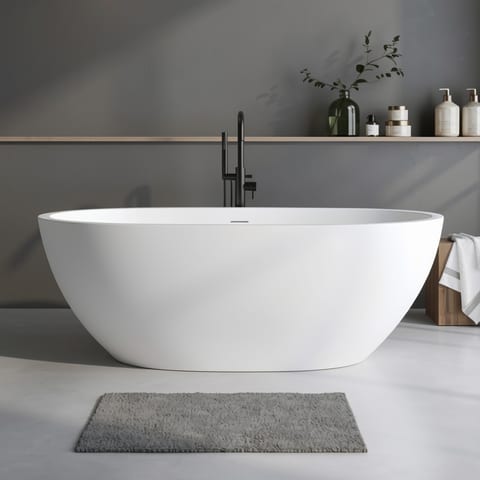 Oval matte white freestanding bathtub with black faucet