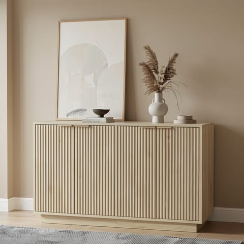 A beige wooden sideboard with fluted doors in a modern living room