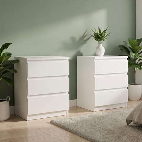 White 3-drawer nightstand in a bedroom with a record player on top